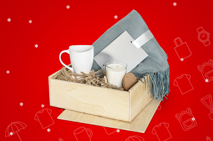 kit composto por vela, caneca e manta